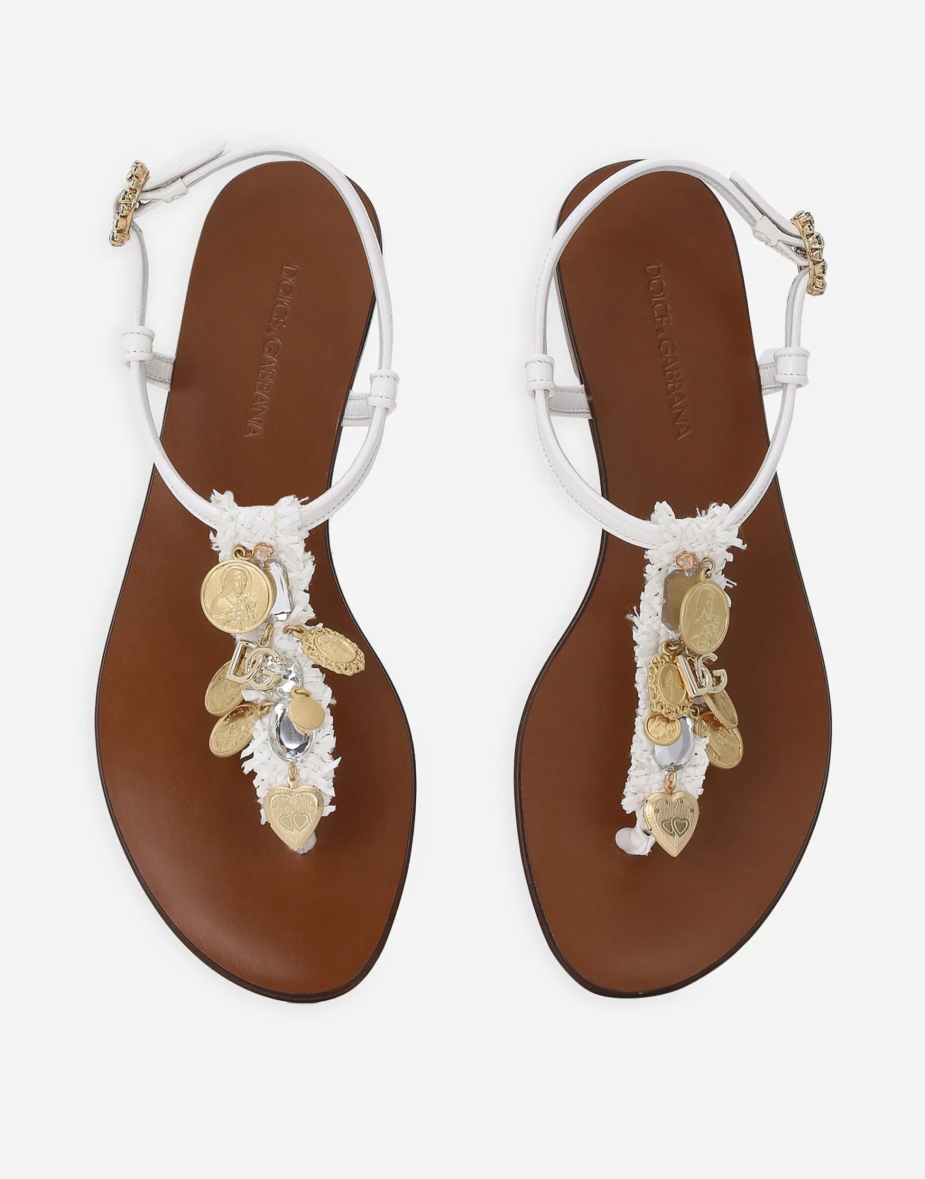 Raffia thong sandals with embroidered votive medallions