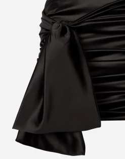 Short draped satin skirt with side bow