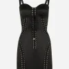Short satin dress with laces and eyelets