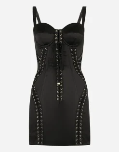 Short satin dress with laces and eyelets