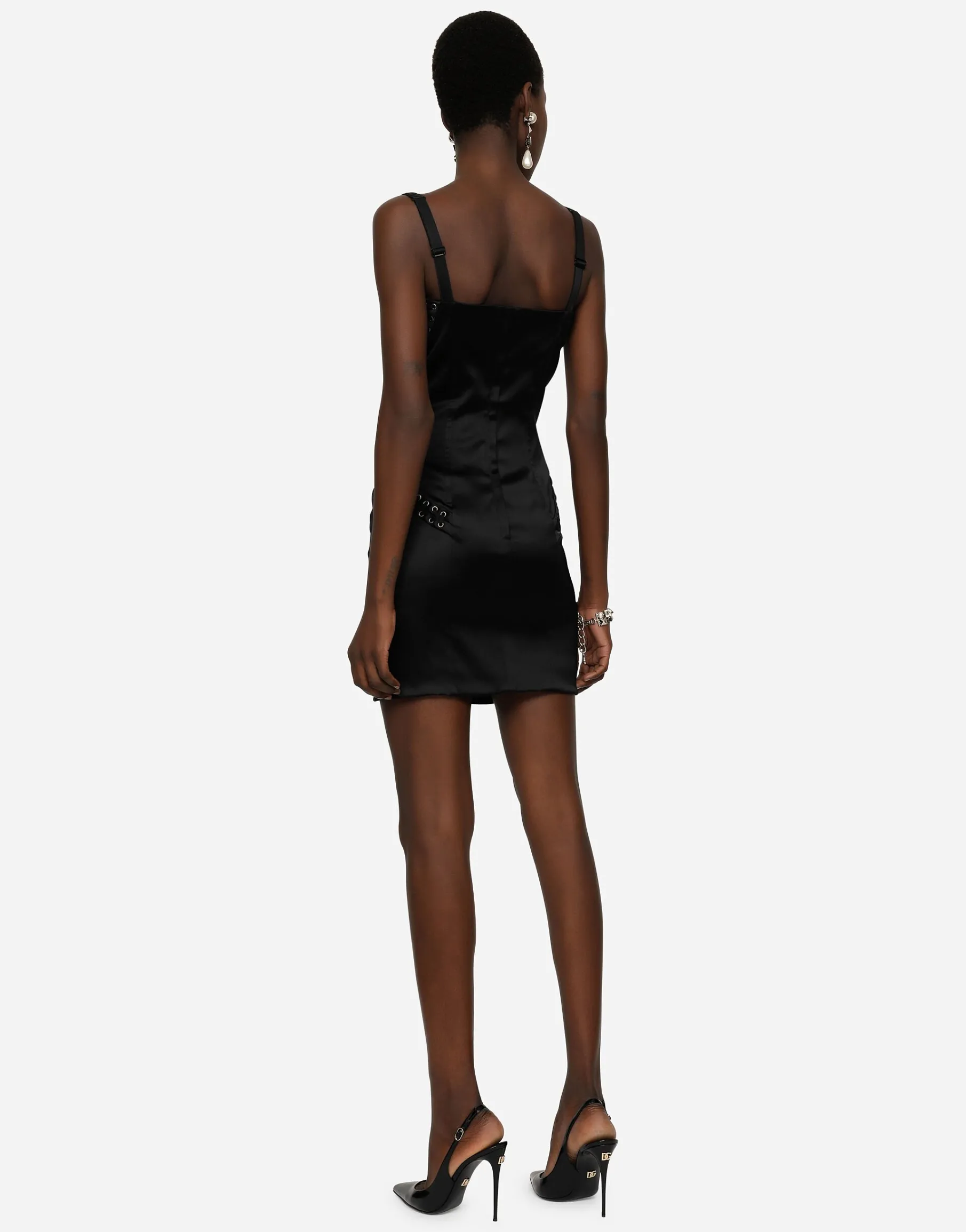 Short satin dress with laces and eyelets