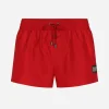Short swim trunks with branded tag