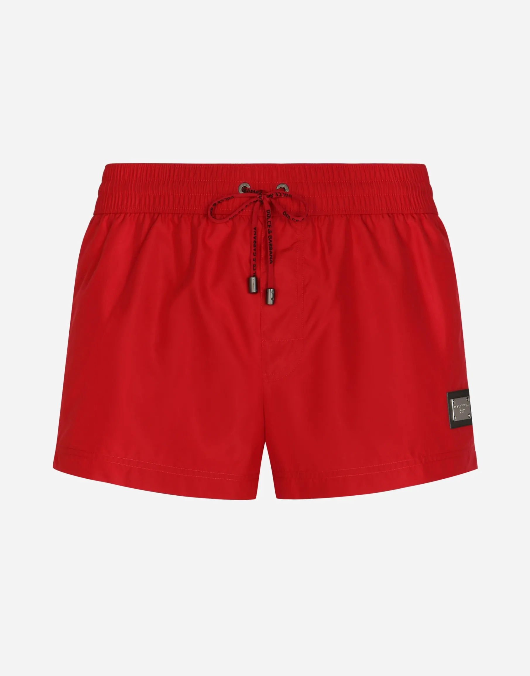 Short swim trunks with branded tag