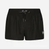Short swim trunks with branded tag