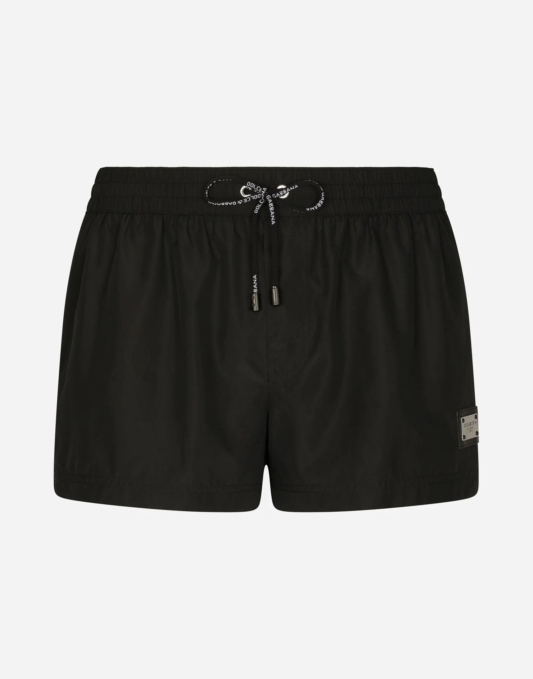 Short swim trunks with branded tag