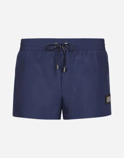 Short swim trunks with branded tag