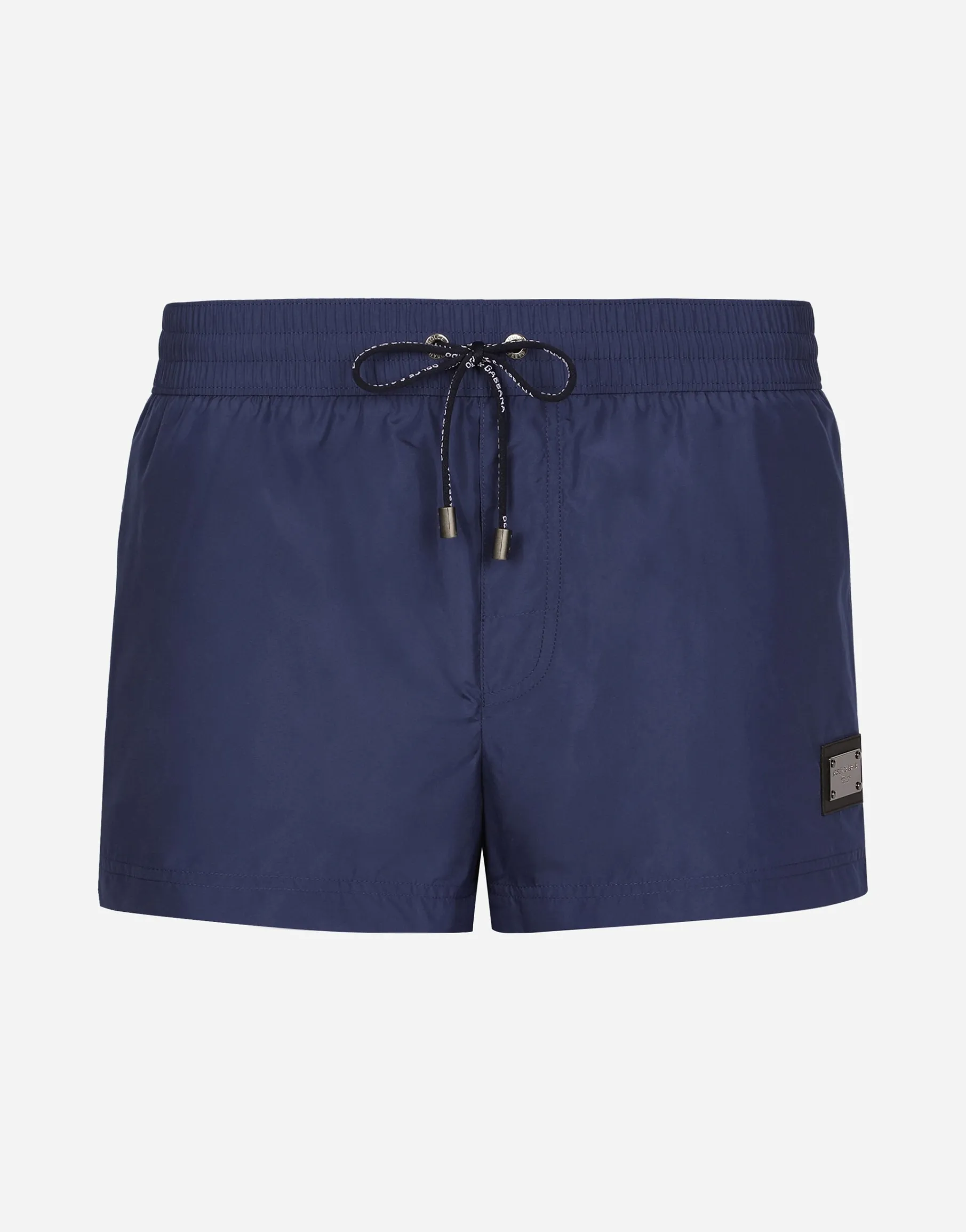 Short swim trunks with branded tag