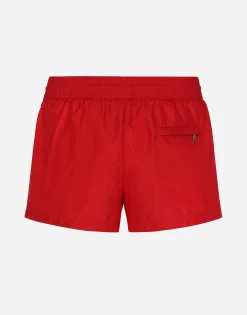 Short swim trunks with branded tag