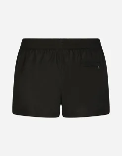 Short swim trunks with branded tag