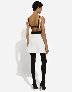 Short woolen dress with satin belt and straps
