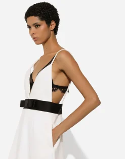 Short woolen dress with satin belt and straps