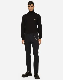 Stretch cotton pants with branded tag