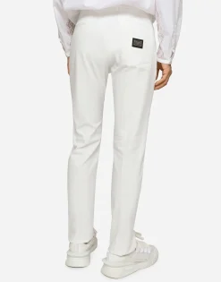 Stretch cotton pants with branded tag