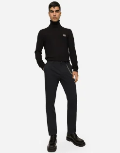 Stretch cotton pants with branded tag