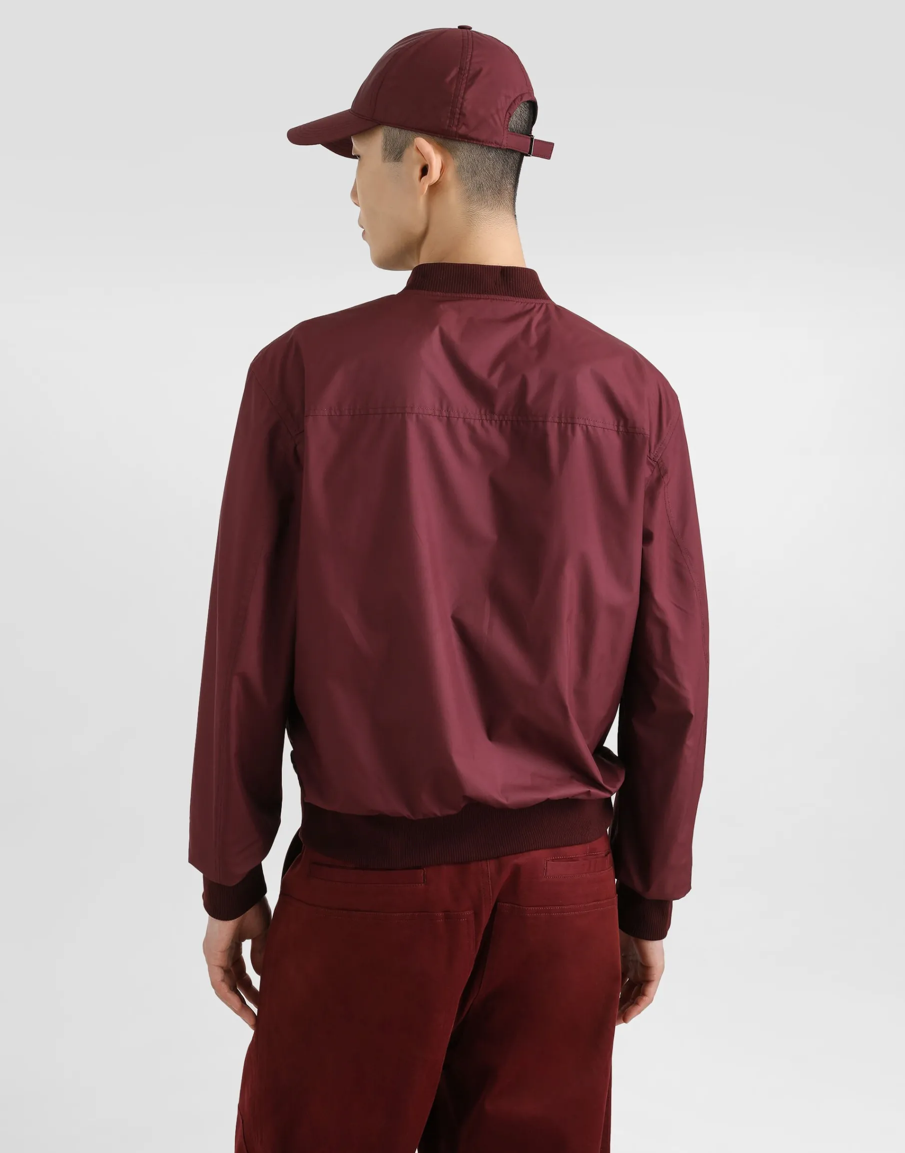 Technical fabric bomber jacket with tag