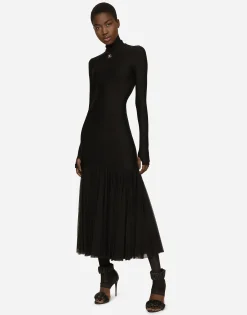 Technical jersey dress with tulle ruffle