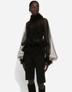 Tulle blouse with ruffles on the neck and cuffs