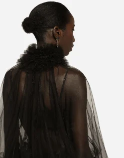 Tulle blouse with ruffles on the neck and cuffs