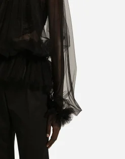Tulle blouse with ruffles on the neck and cuffs