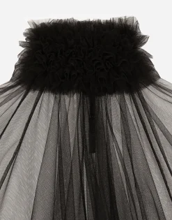 Tulle blouse with ruffles on the neck and cuffs