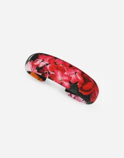 Viyella hairband with floral print over a black background