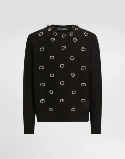 Wool round-neck sweater with embroidery and bejeweled buttons
