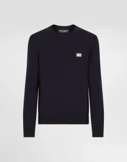 Wool round-neck sweater with branded tag