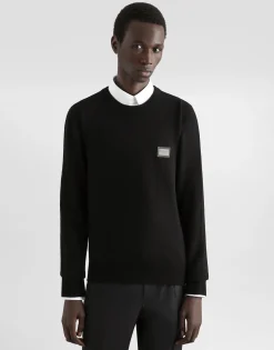 Wool round-neck sweater with branded tag