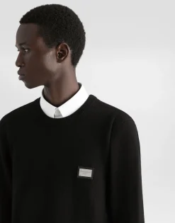 Wool round-neck sweater with branded tag