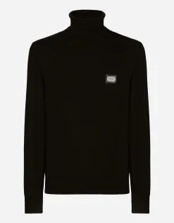 Wool turtle-neck sweater with branded tag