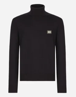 Wool turtle-neck sweater with branded tag