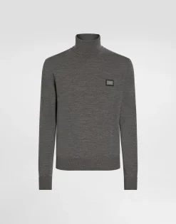 Wool turtle-neck sweater with branded tag