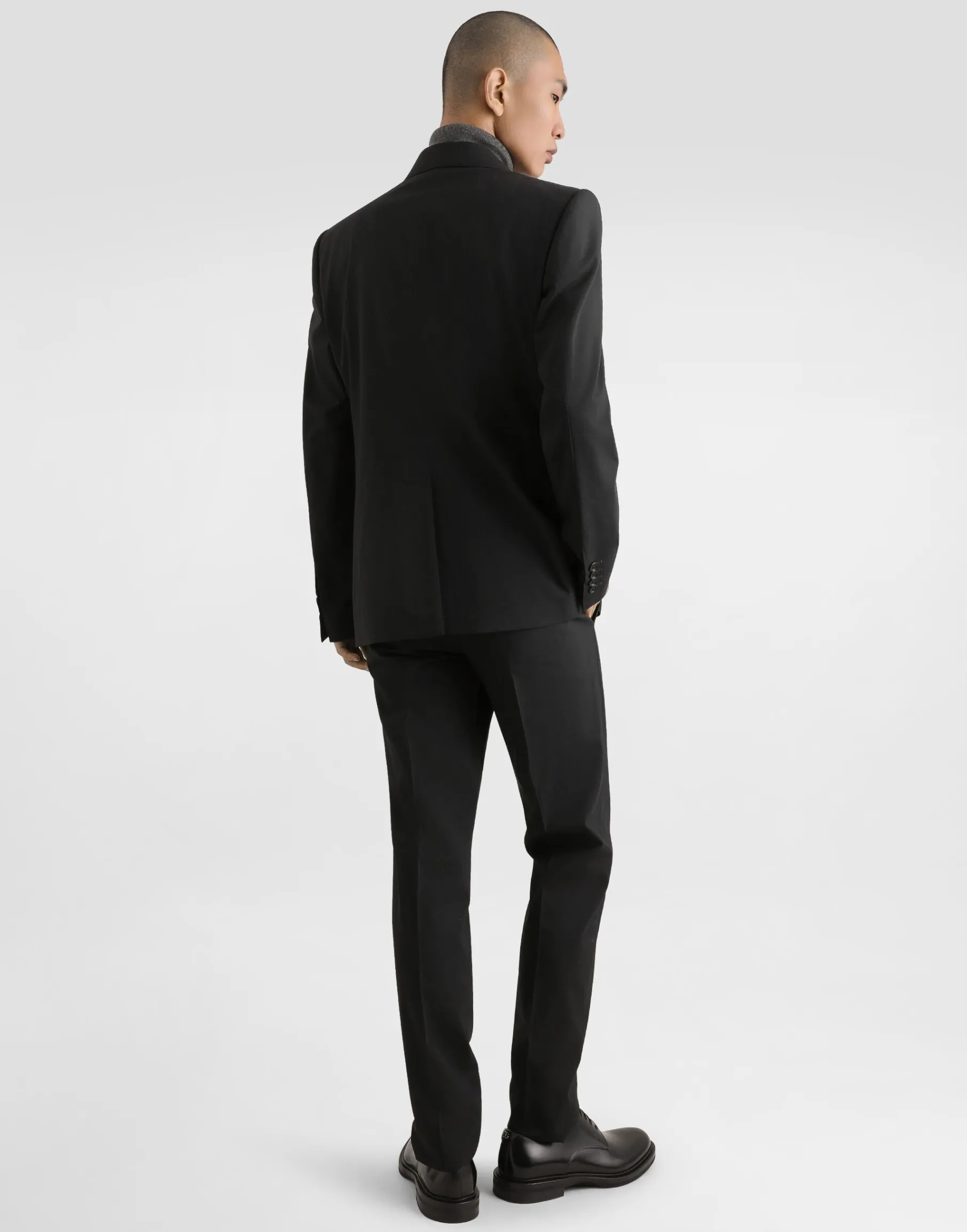 Wool turtle-neck sweater with branded tag