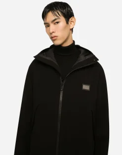 Wool turtle-neck sweater with branded tag