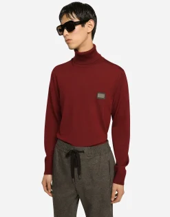 Wool turtle-neck sweater with branded tag