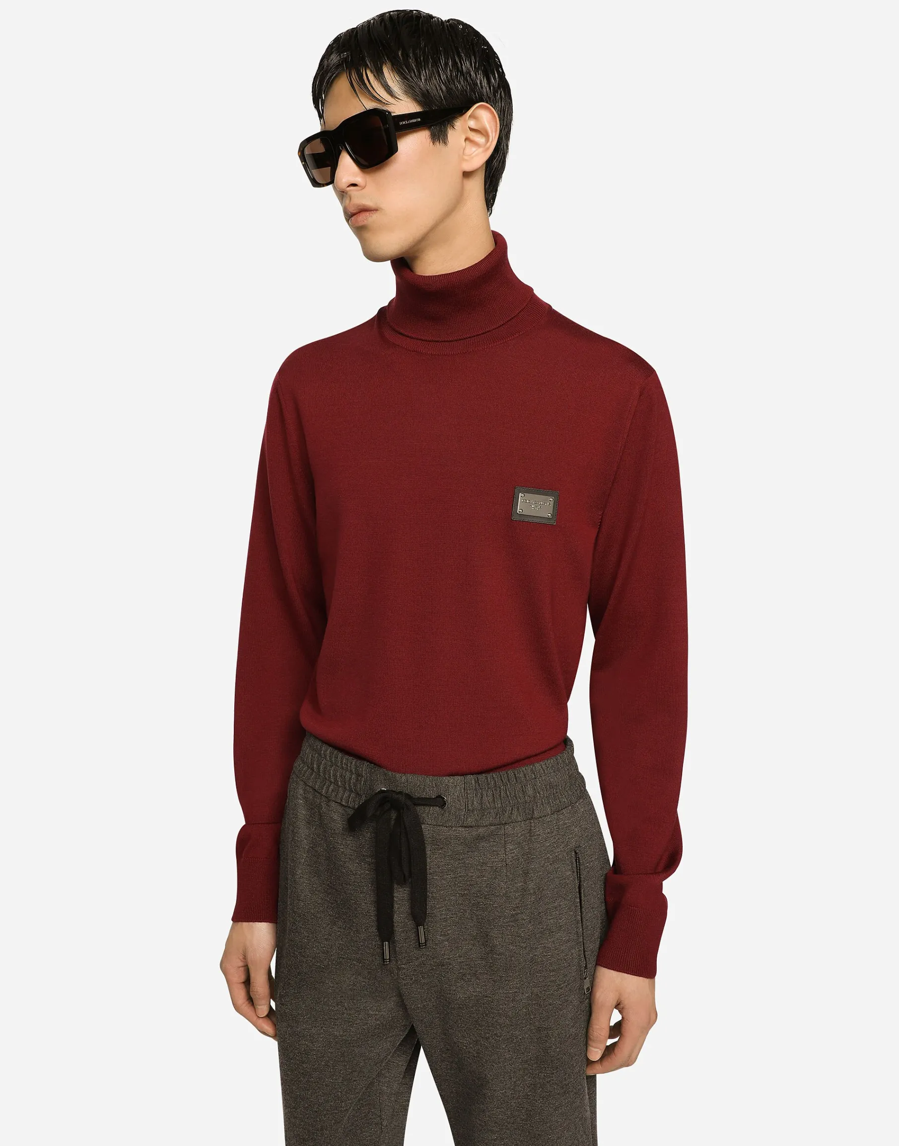 Wool turtle-neck sweater with branded tag