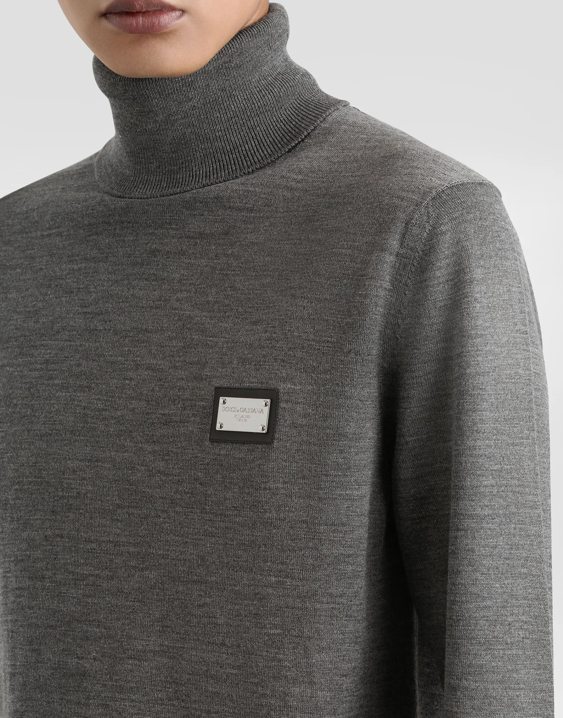 Wool turtle-neck sweater with branded tag