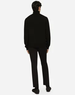 Wool turtle-neck sweater with branded tag