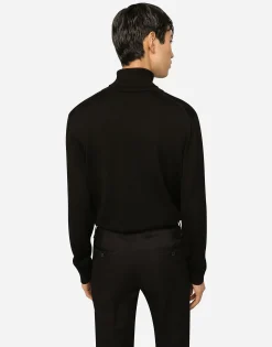 Wool turtle-neck sweater with branded tag