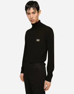 Wool turtle-neck sweater with branded tag